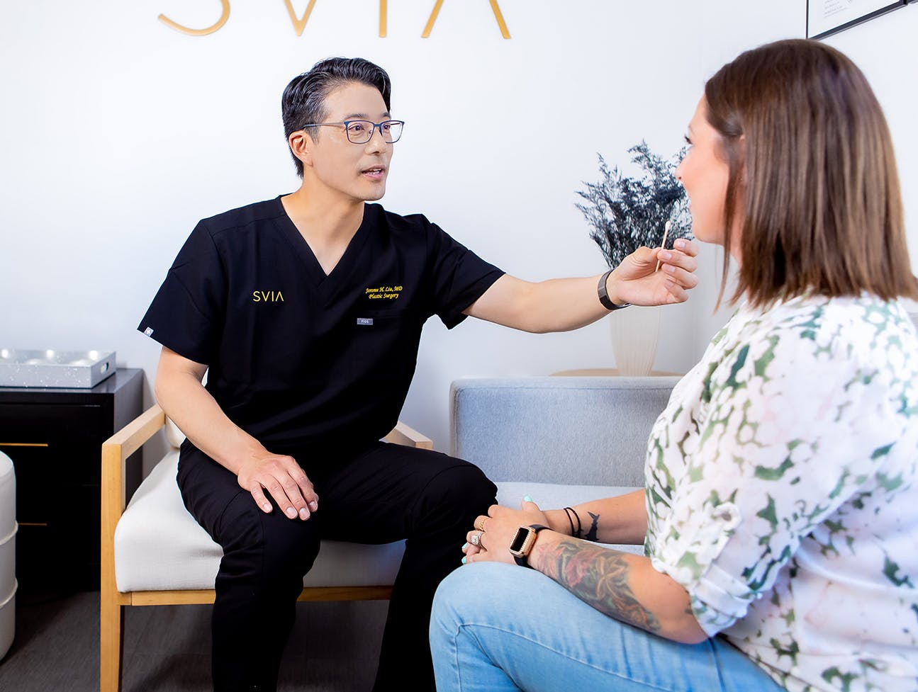 Dr. Liu with a patient
