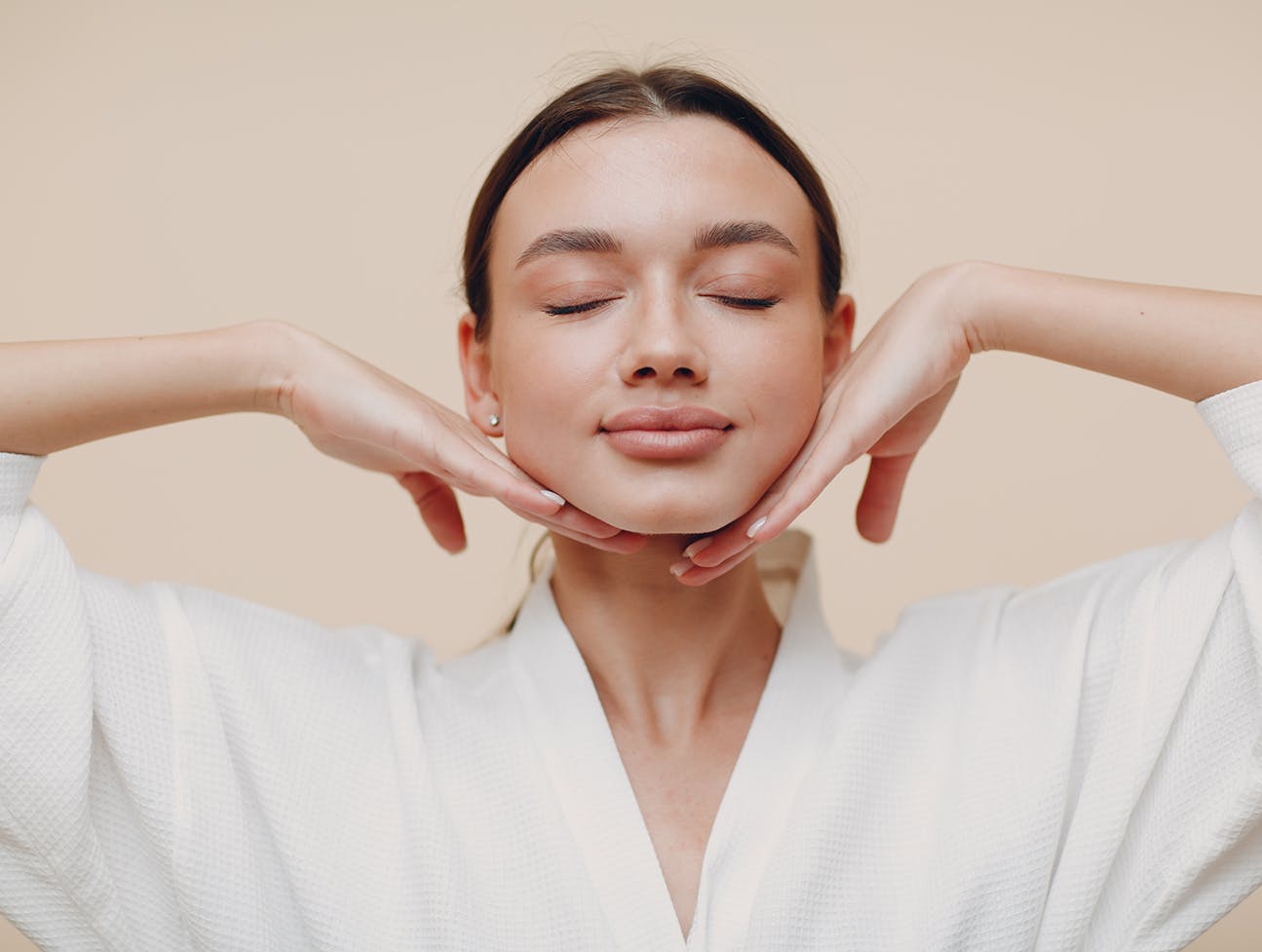 woman in robe with hair pulled back