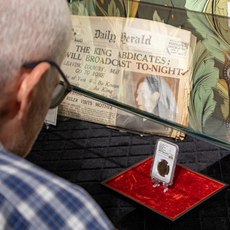 Image of collector viewing King Edward VIII Penny at Showpiece's private exhibition