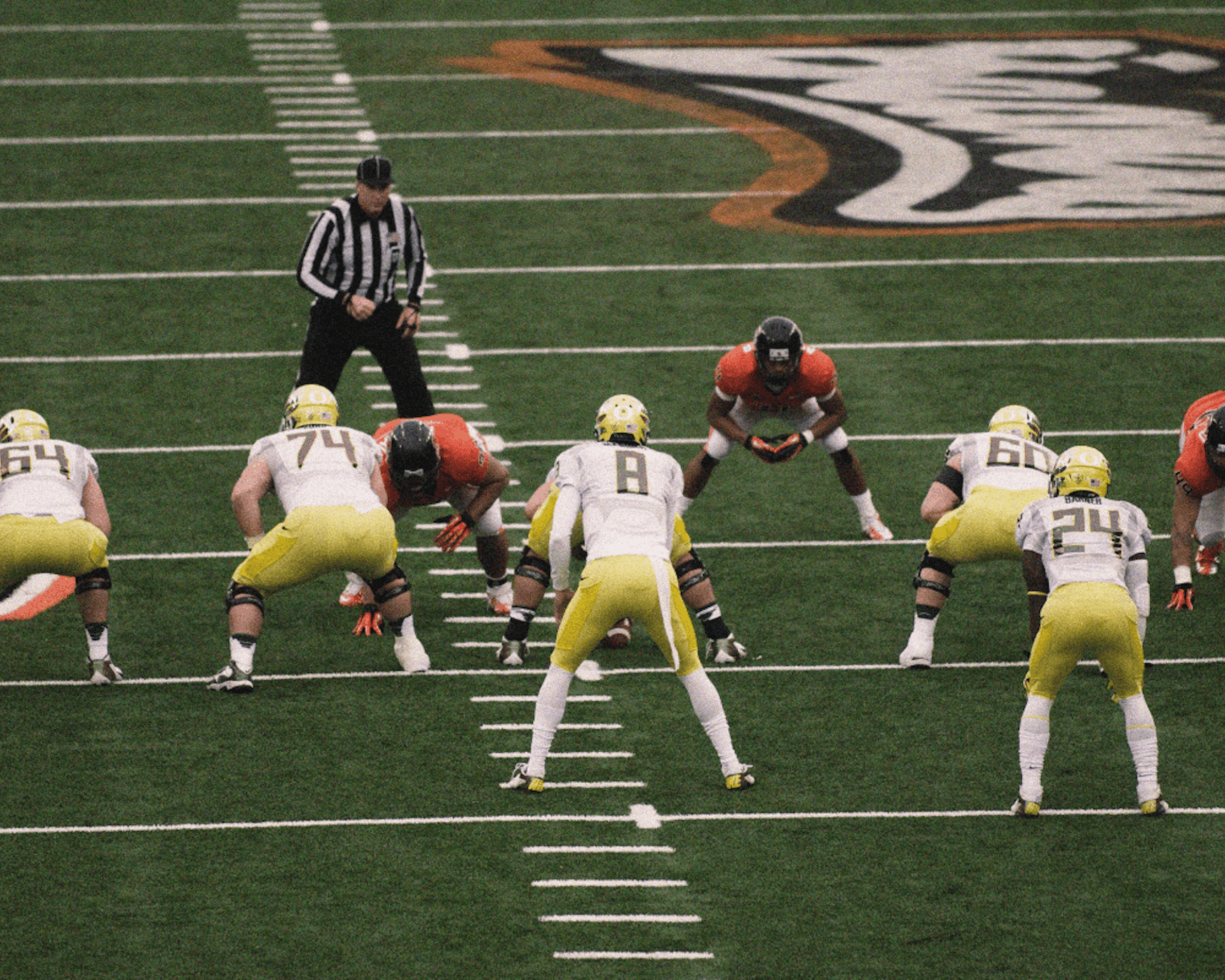 University of Oregon football team in action. Credit: Flickr Account osubeaver2000 (modifications made)