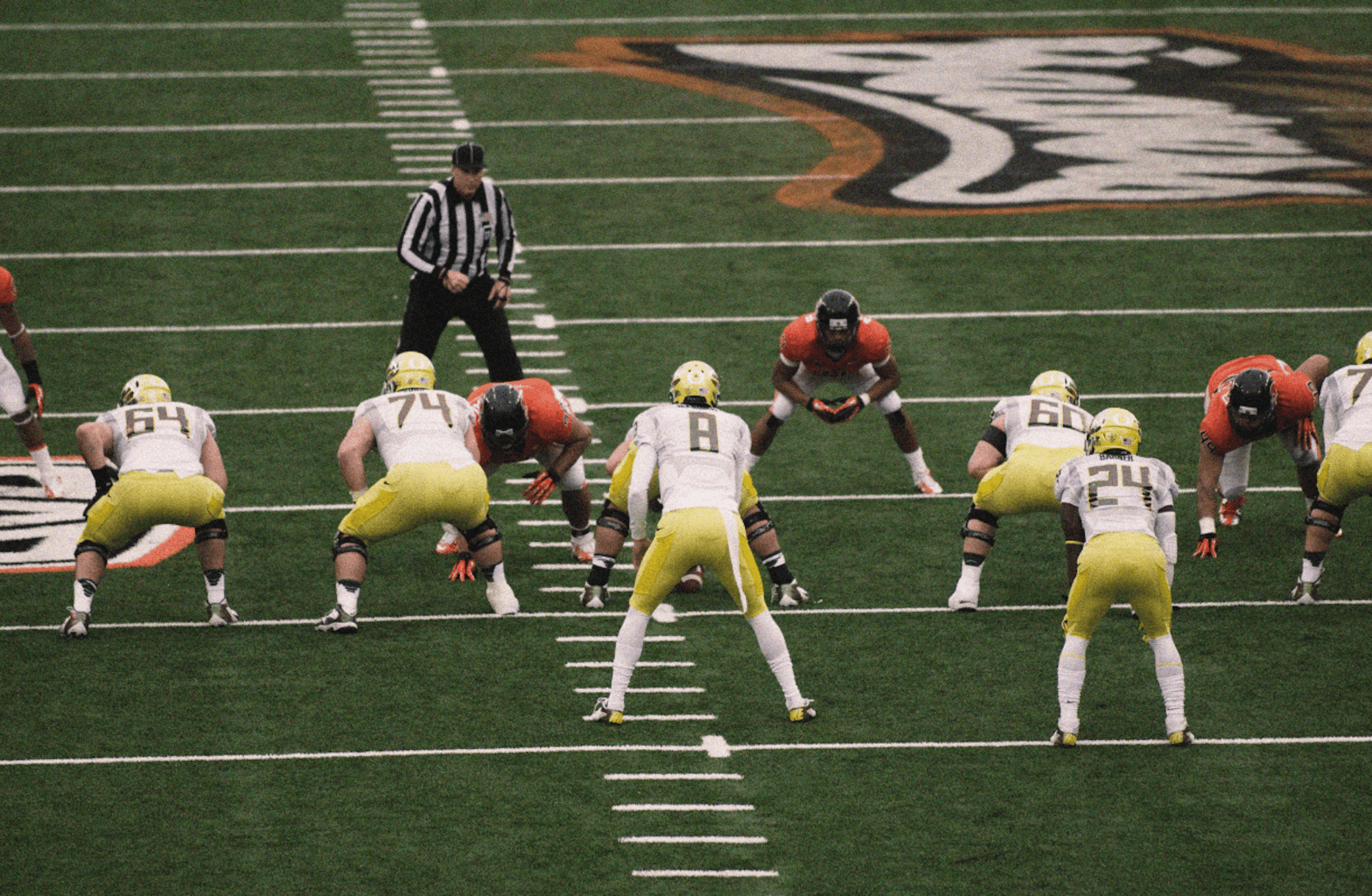 University of Oregon football team in action. Credit: Flickr Account osubeaver2000 (modifications made)