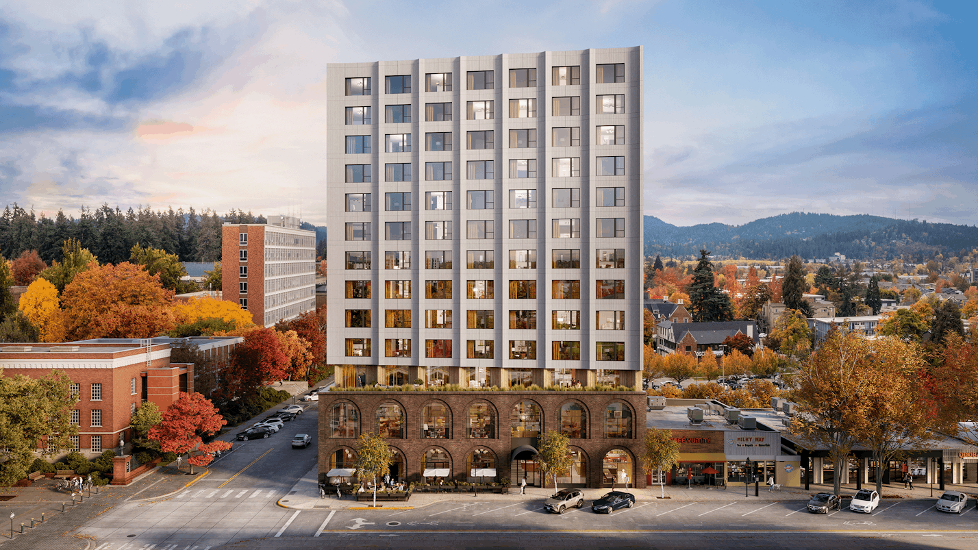 A rendering of a modern condominium building as it sits on the corner of a block in Eugene, OR.