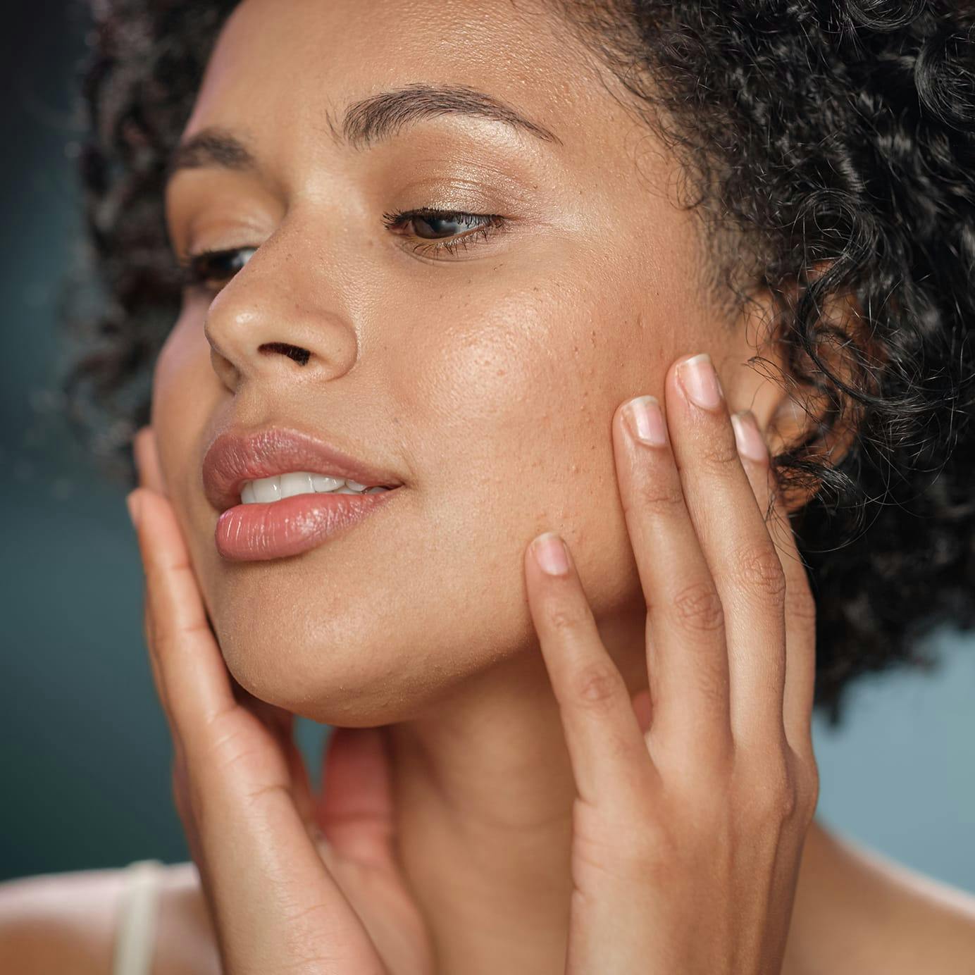 Woman touching her face