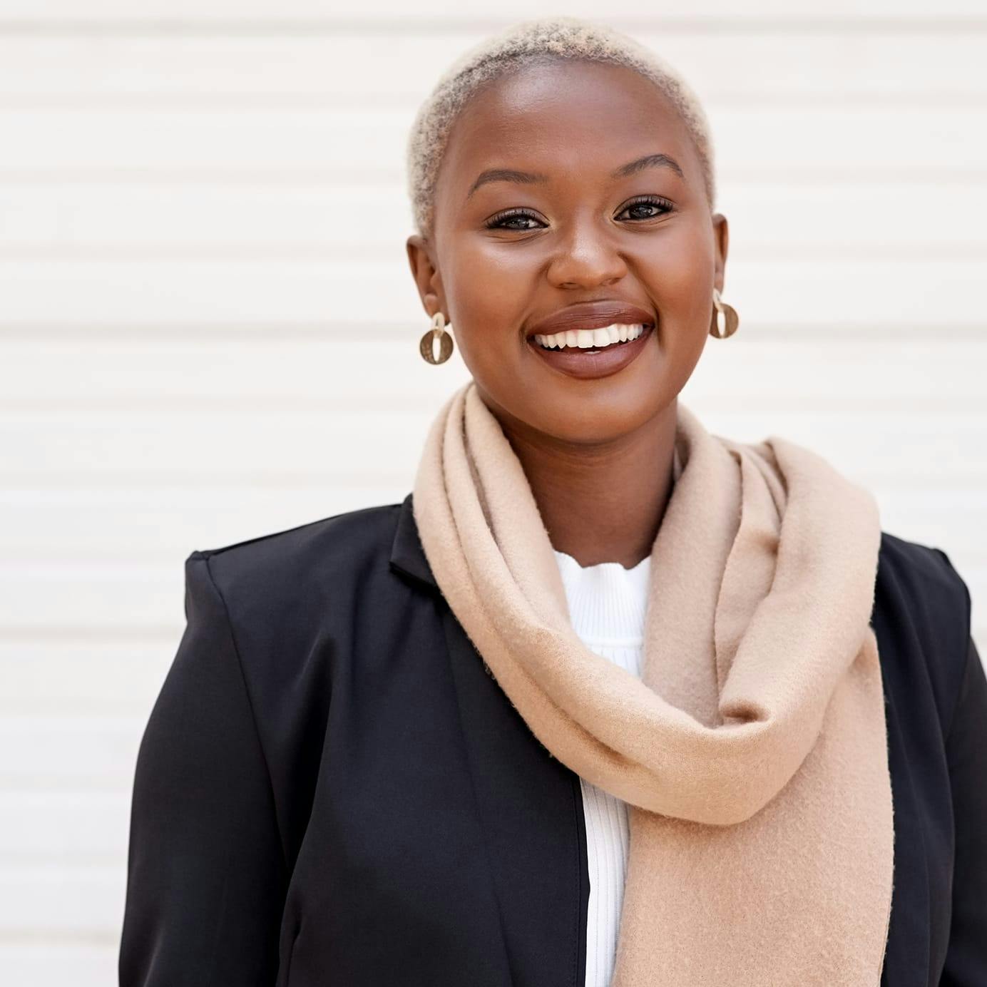 Woman wearing a scarf smiling