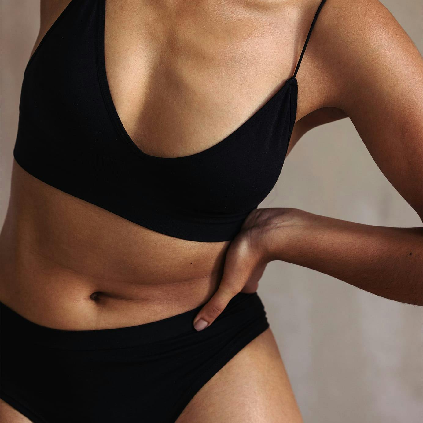 Woman in black bra and underwear set