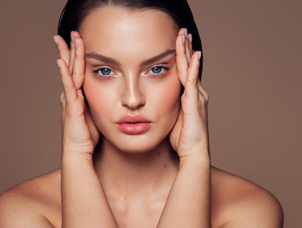 Woman touching her face