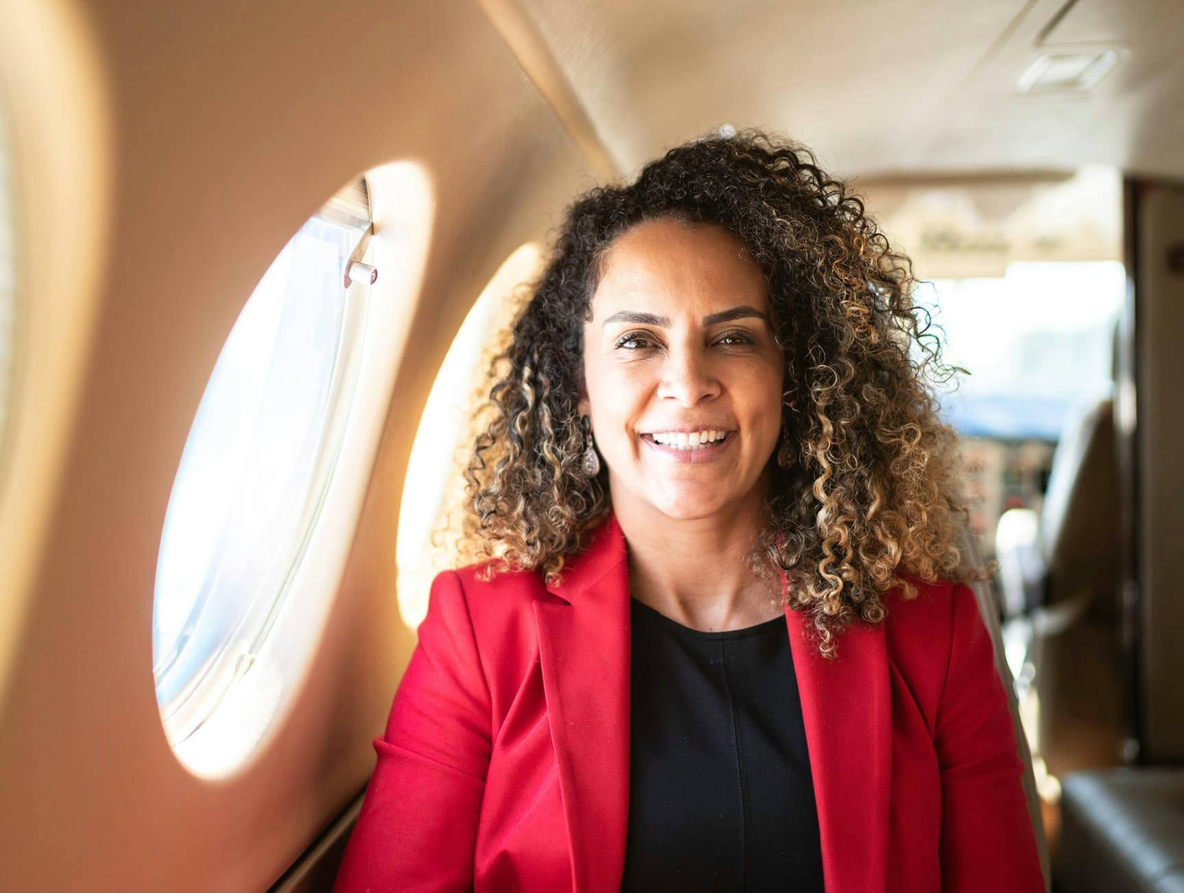 Woman on a plane smiling