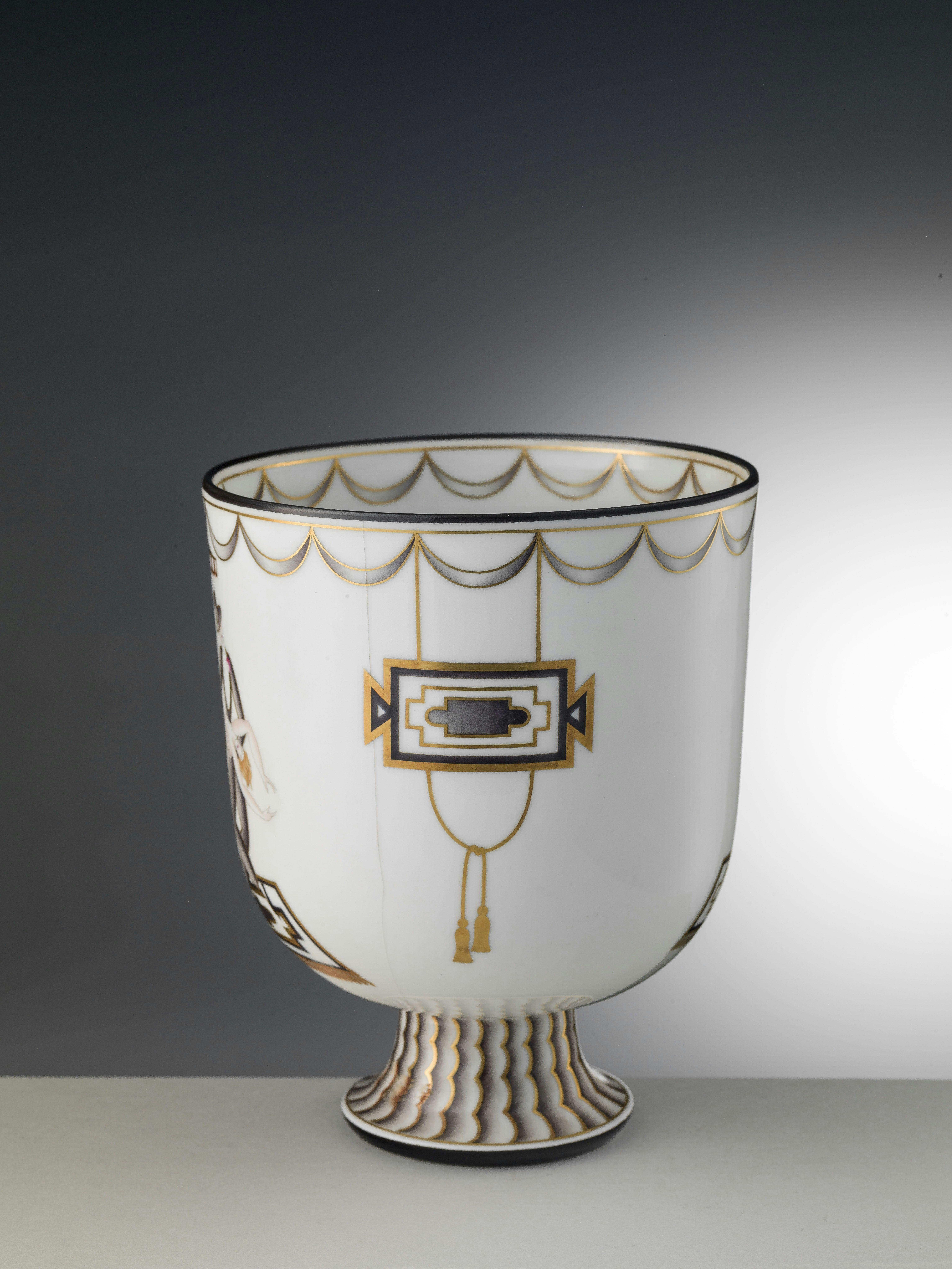 Back of the white cup with gold decorations