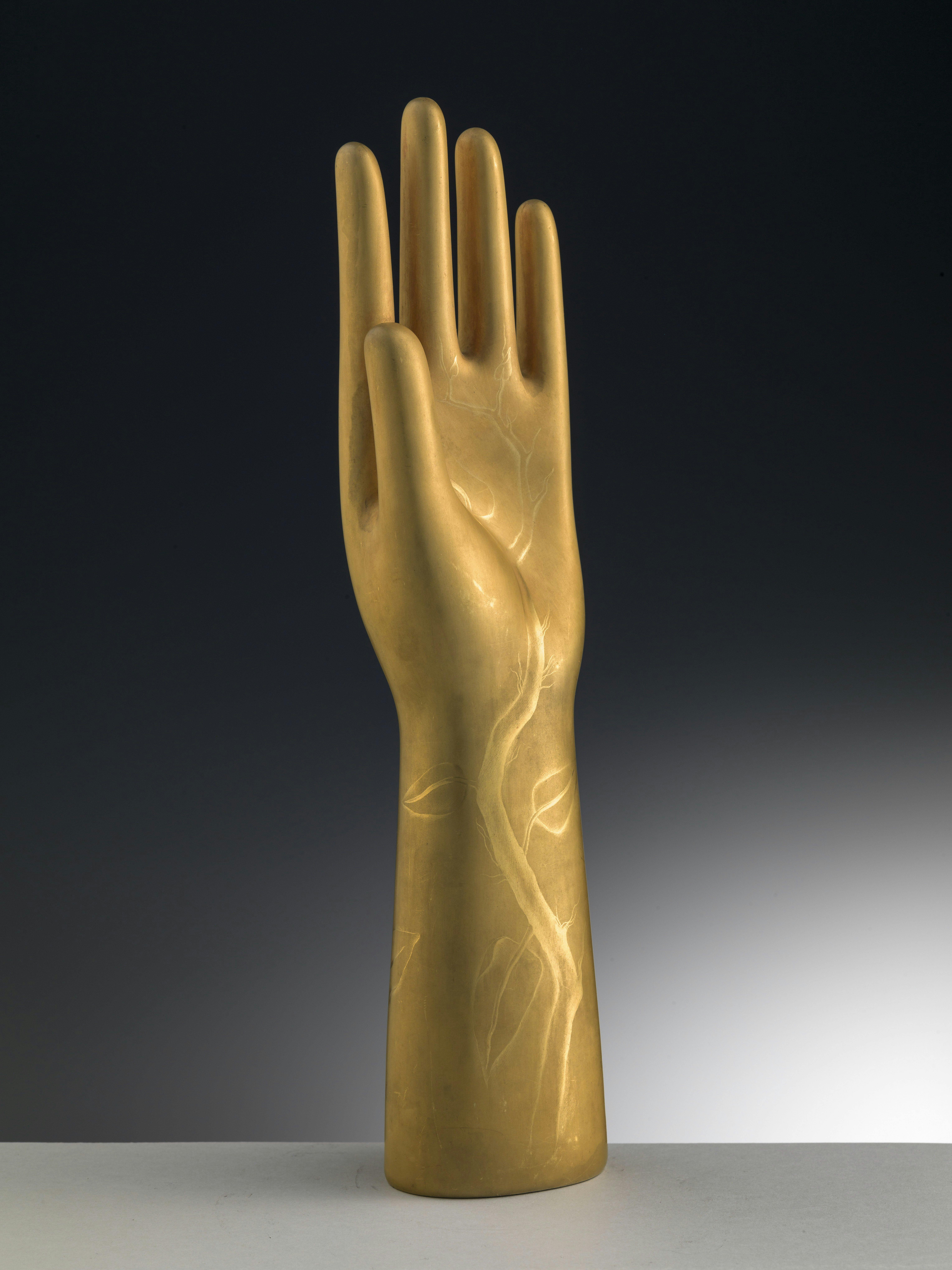 Golden hand-shaped sculpture