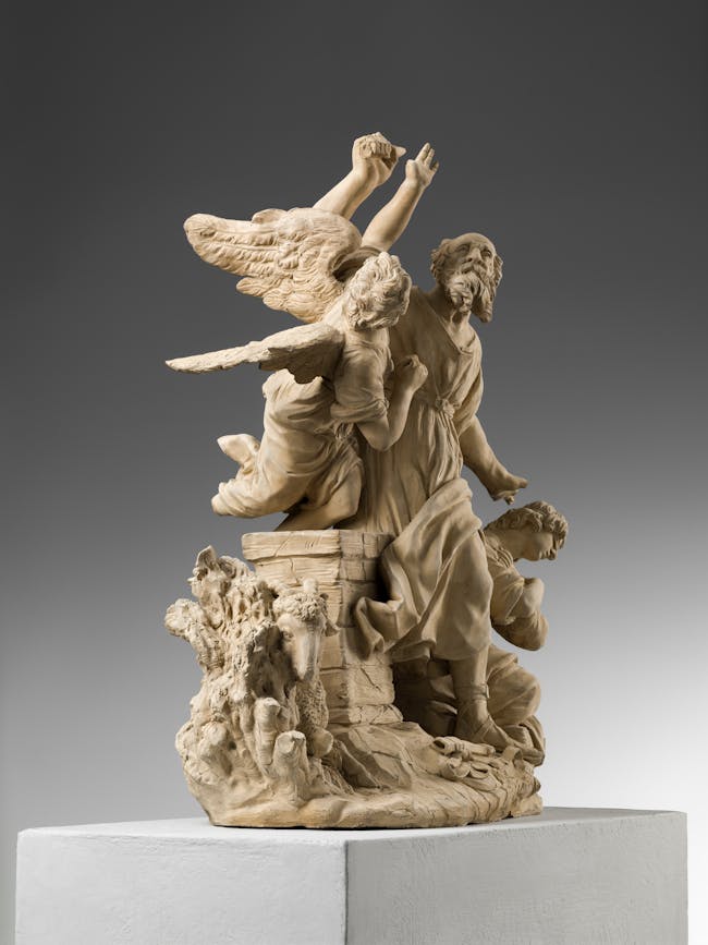 Vista laterale del gruppo scultoreo, con angelo e agnello in primo piano