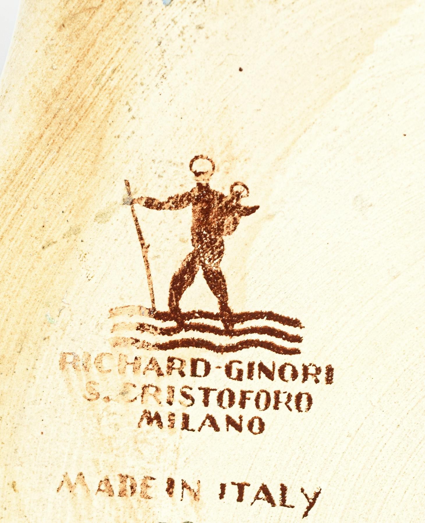 Figura stilizzata di San Cristoforo tra le onde, con sotto timbro di fabbrica e la scritta Made in Italy