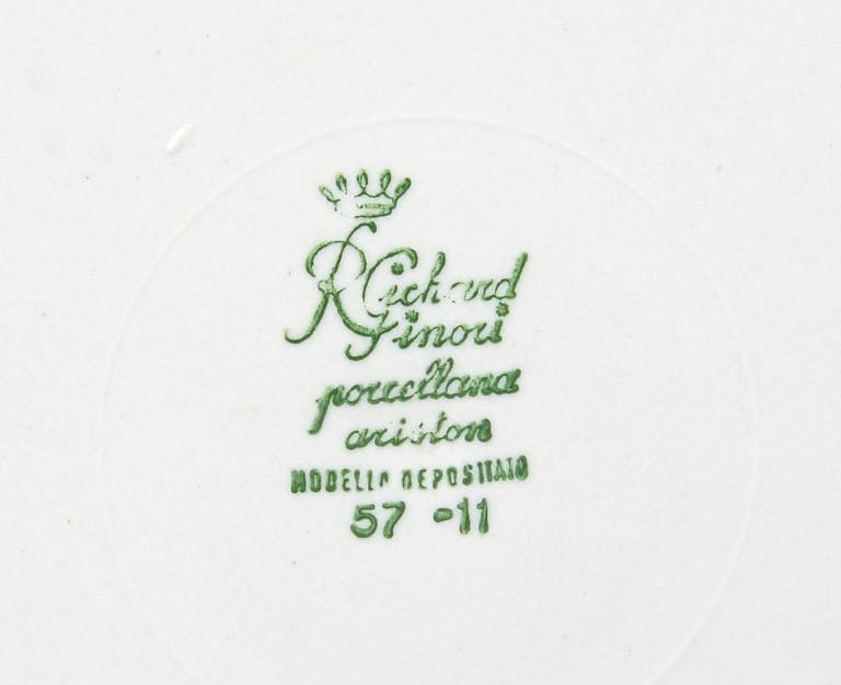Crown with inscriptions and numbers below in green.