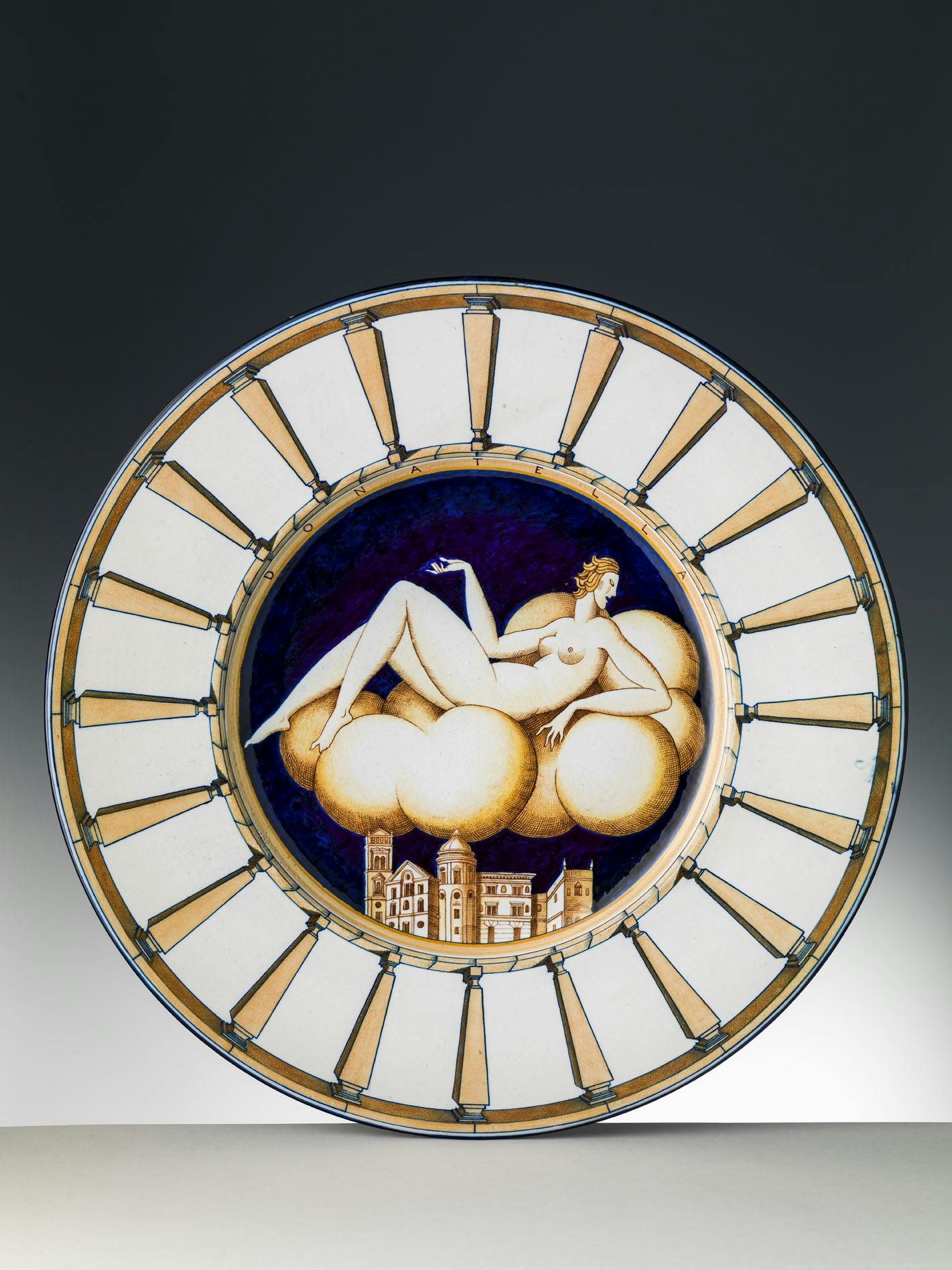 Plate featuring a woman reclining on a cloud at the center
