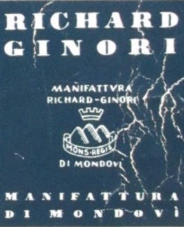Logo della Manifattura di Mondovì, in bianco su fondo blu