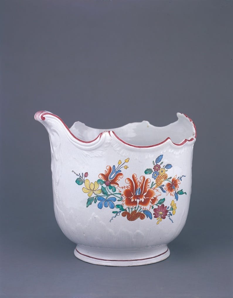 White container decorated with colorful flowers