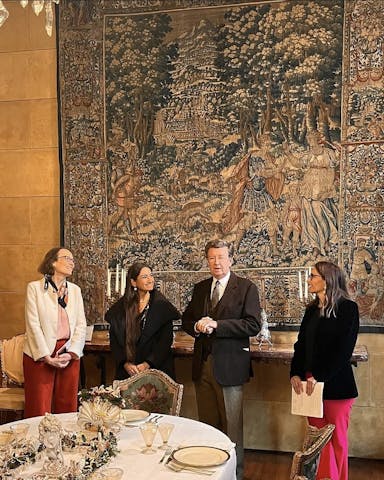 Four people presenting the exhibition