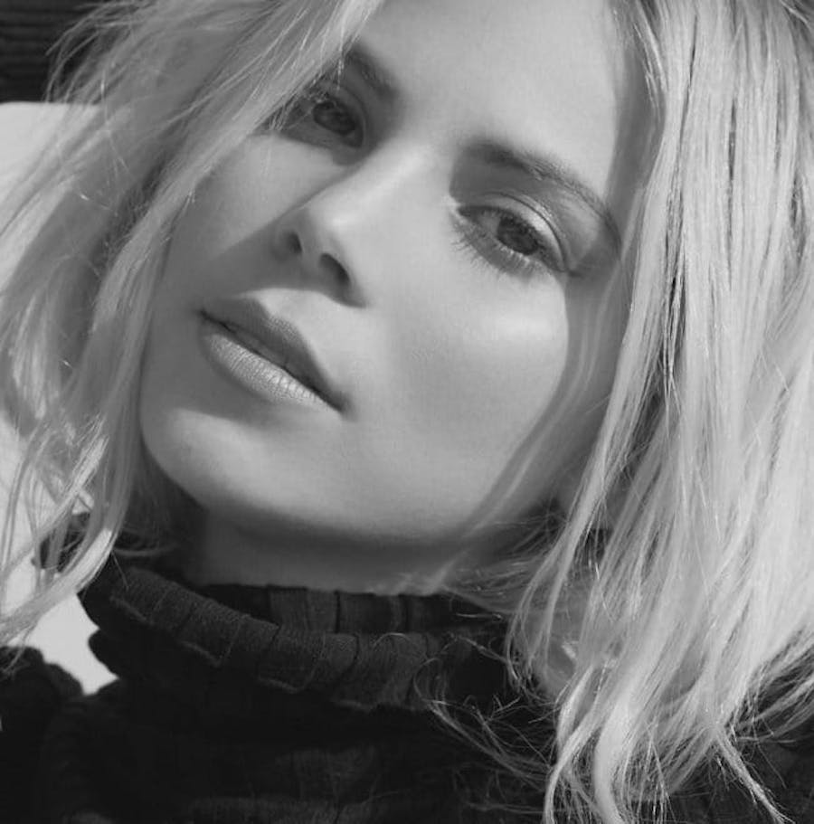 Blonde woman with soft facial features