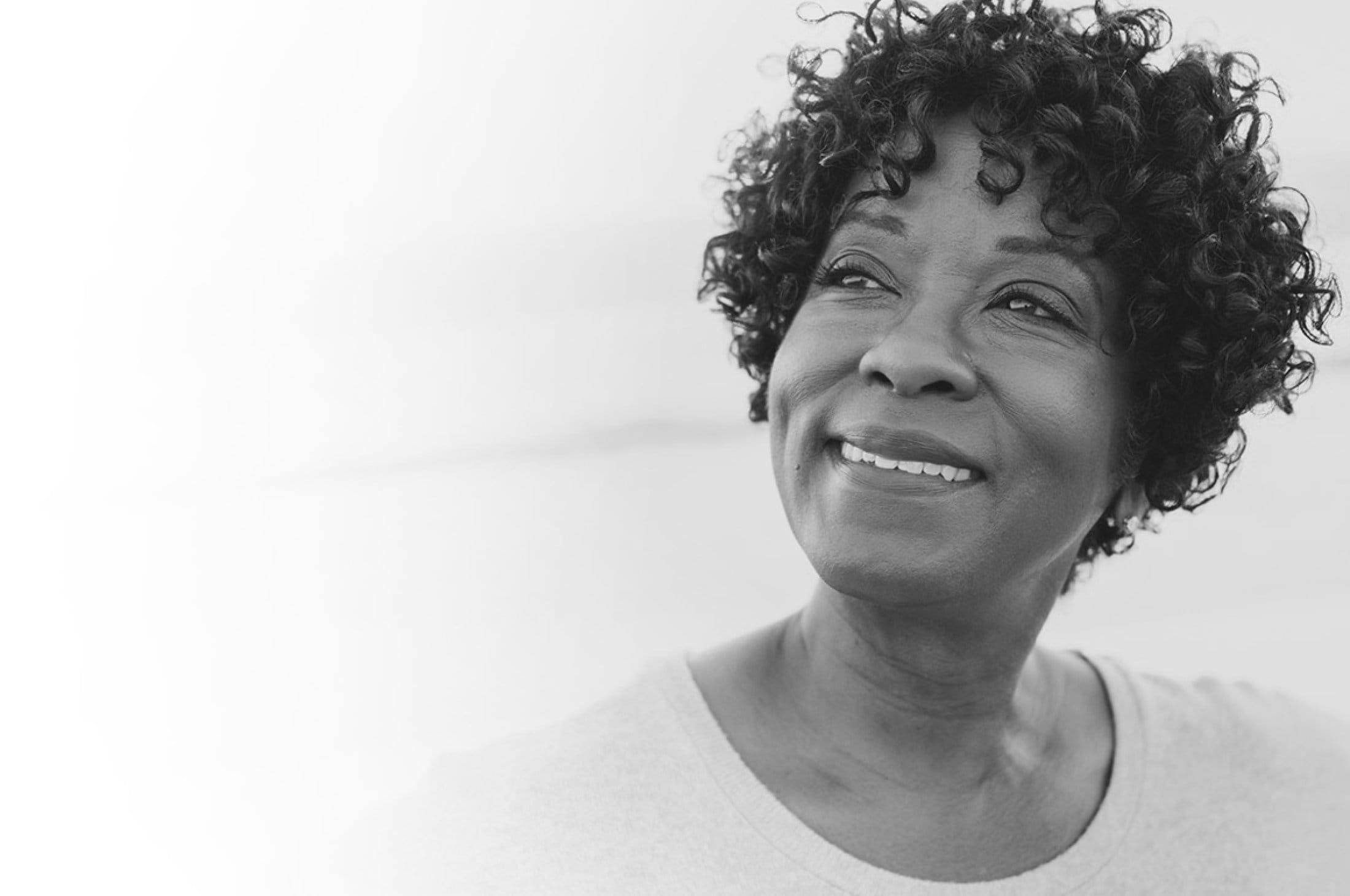An elderly lady with curly hair