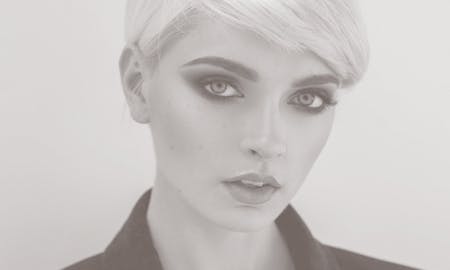 A beautiful blonde woman's face with short hair