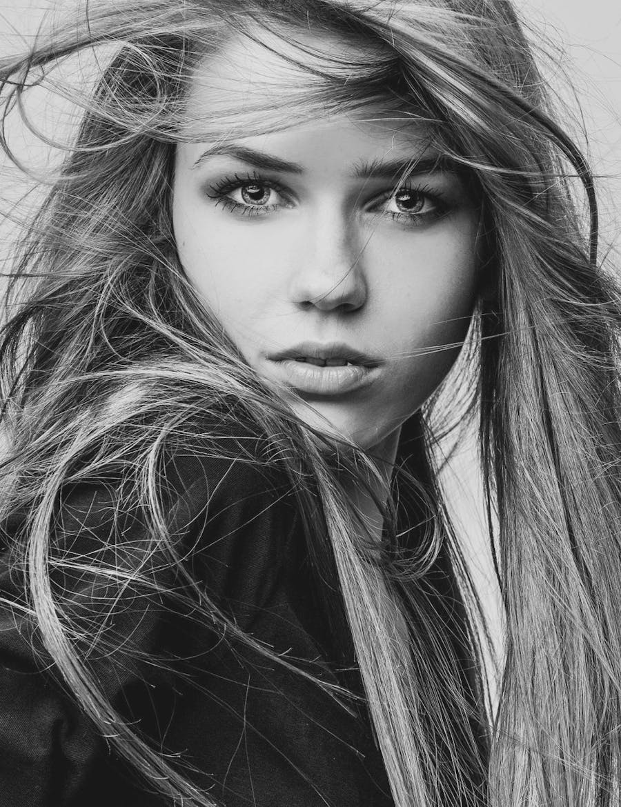 Young female model with wind-blown hair and perfect skin from fraxel laser treatment in Nashville