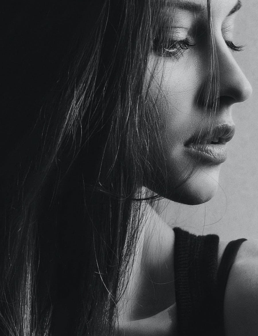 Profile of a woman looking down, highlighting jawline contouring in Nashville.