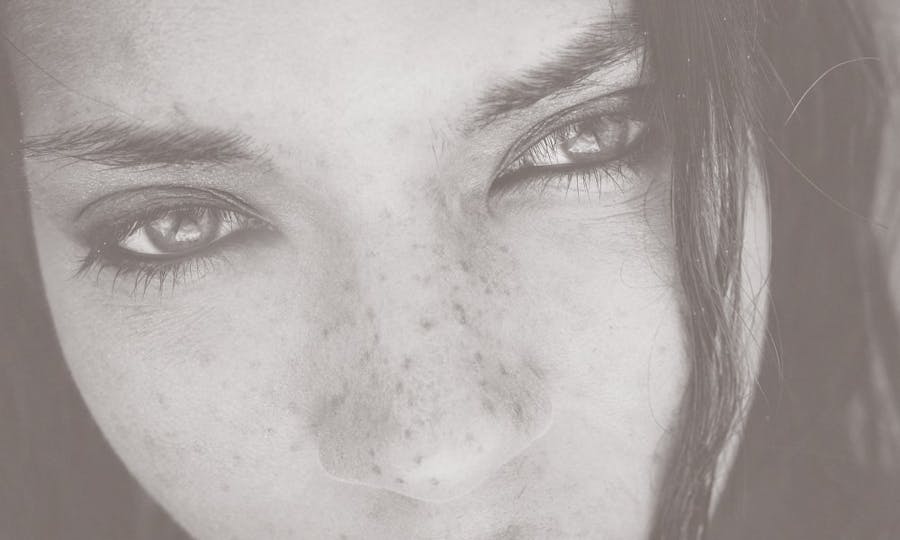 Closeup of a freckled woman's eyes