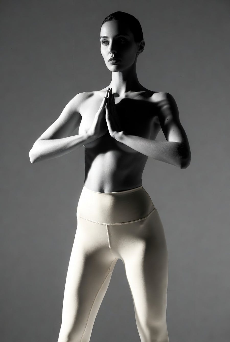 Woman wearing thin workout pants showing smooth body contours