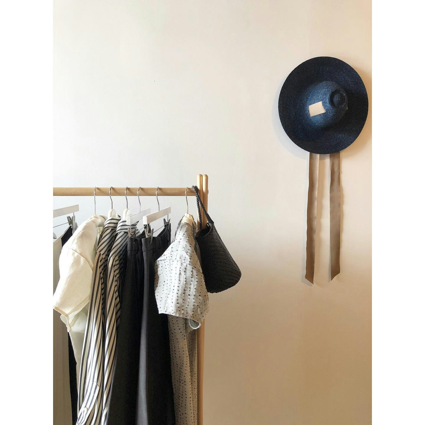 display of clothes on wood rack