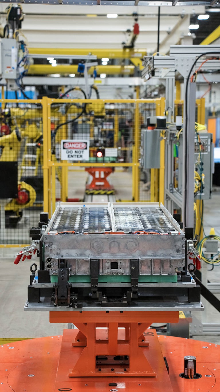 ONE battery with cover off exposing inside components