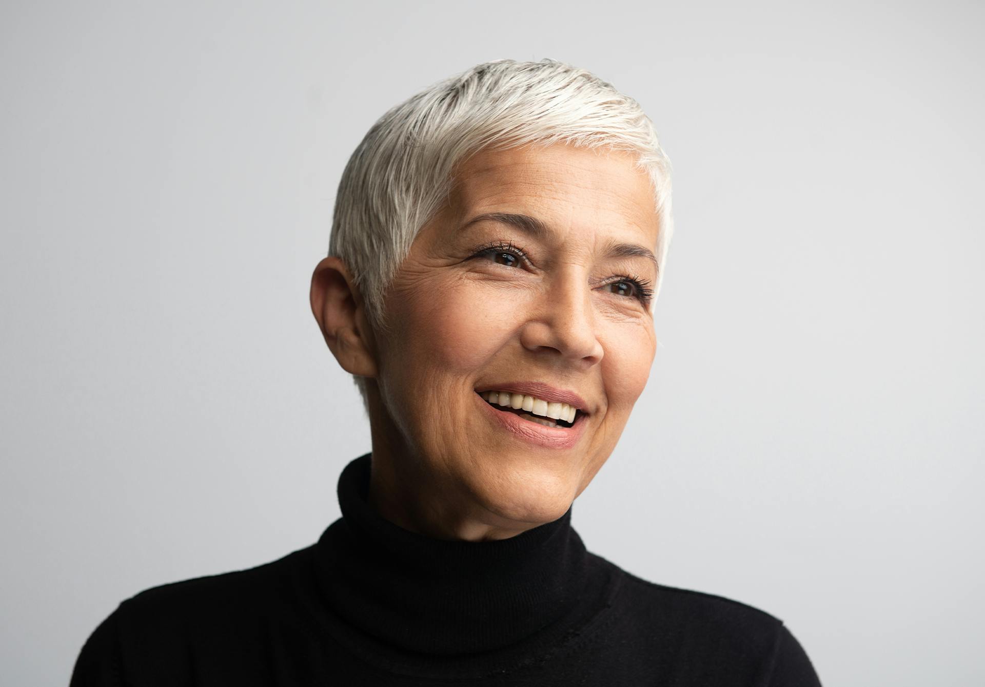 Middle aged woman smiling.
