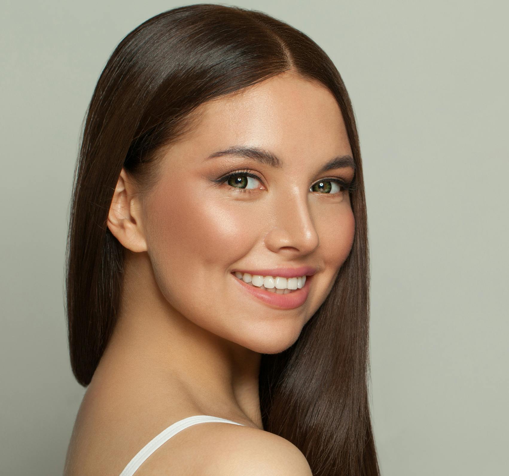 Smiling brunette woman facing a camera.