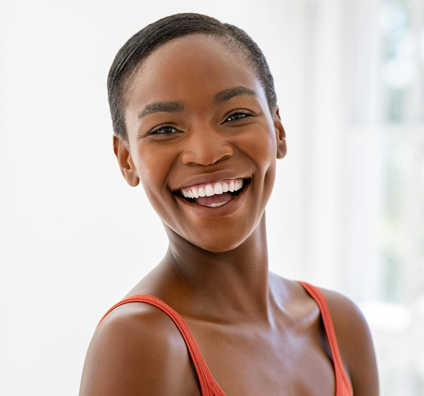 Smiling woman with short hair.