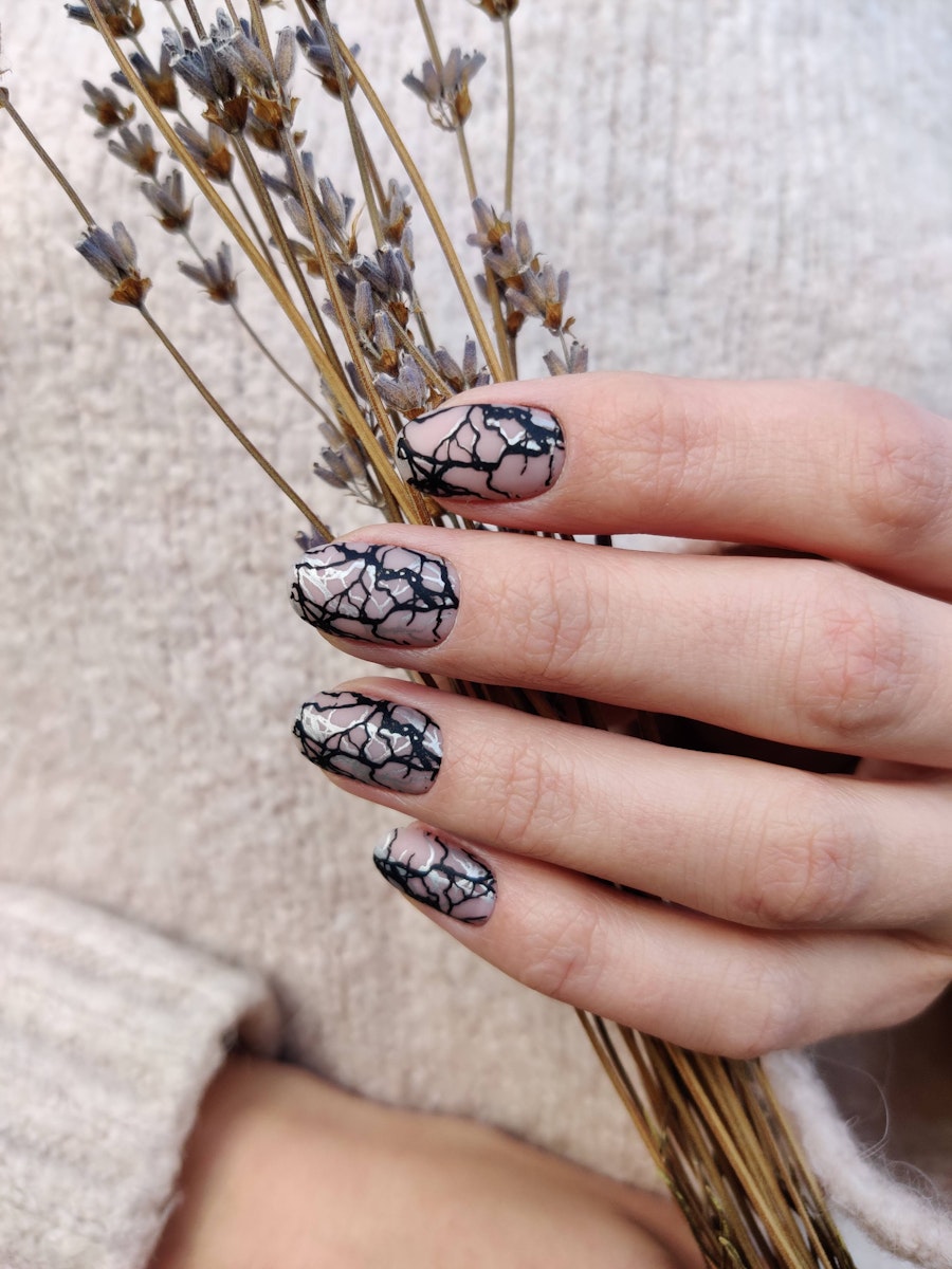 Two-tone abstract design on transparent nails