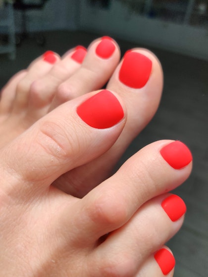 Matte bright scarlet pedicure