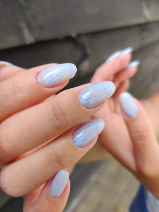 Light blue snake scale print on sheer long nails