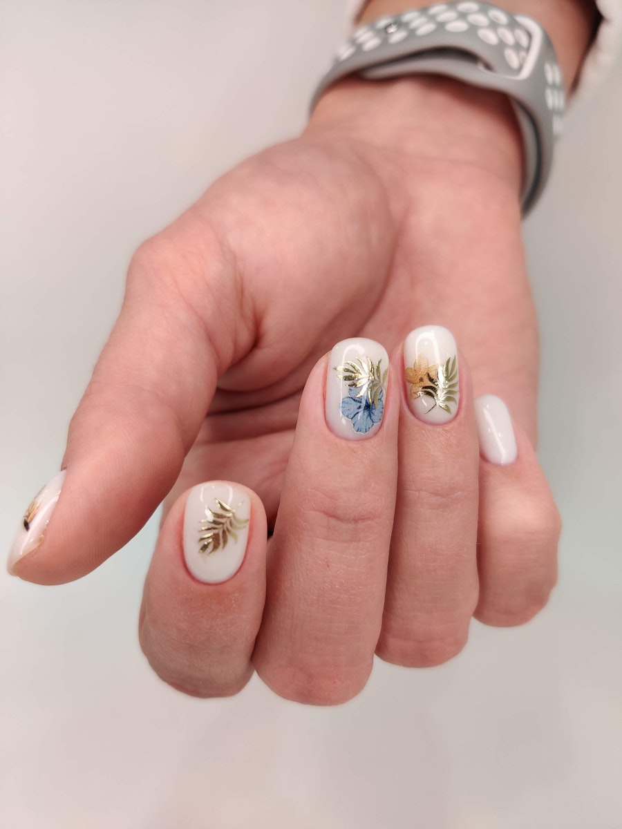 Floral design on ivory nails
