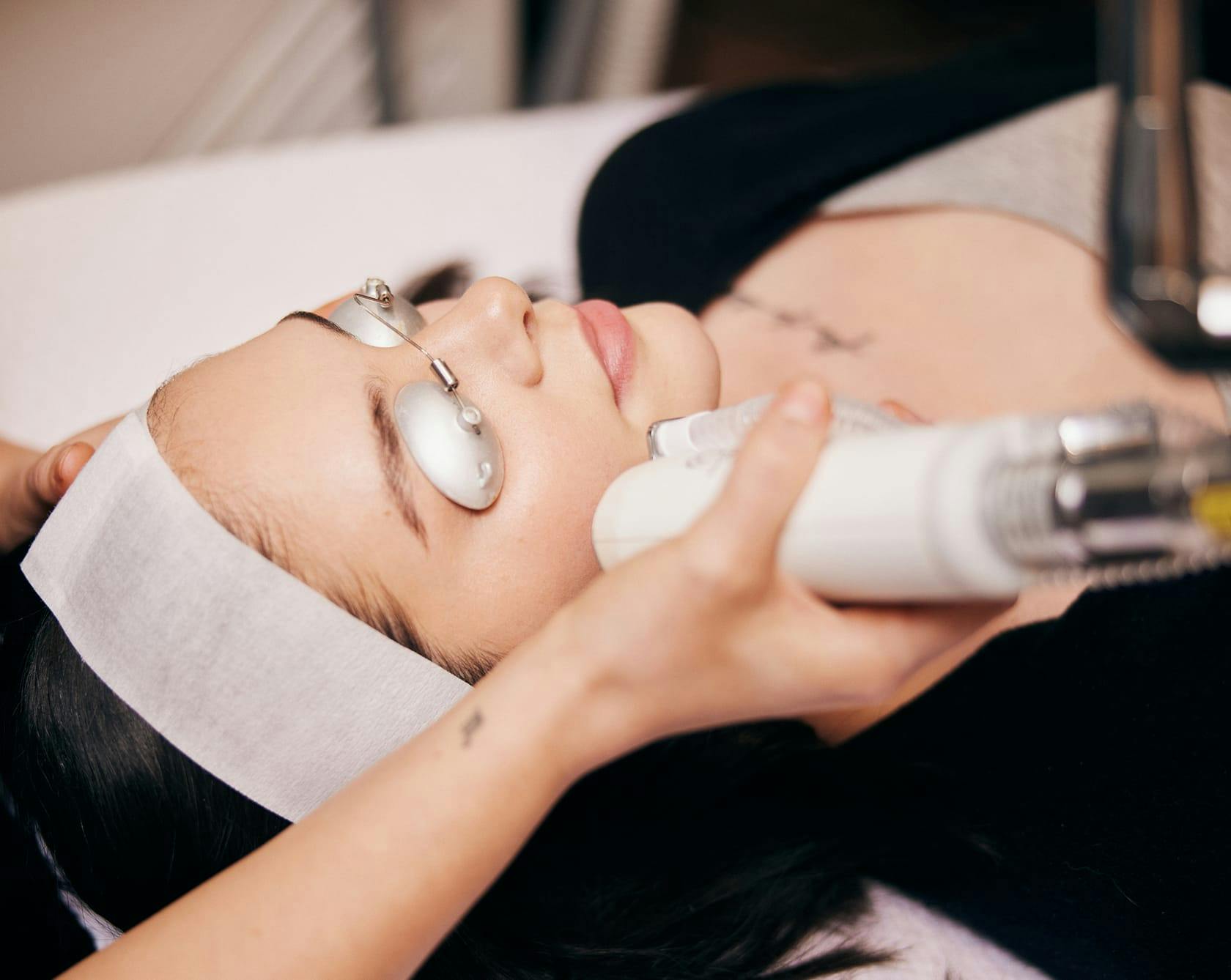 an image of a woman getting a laser facial