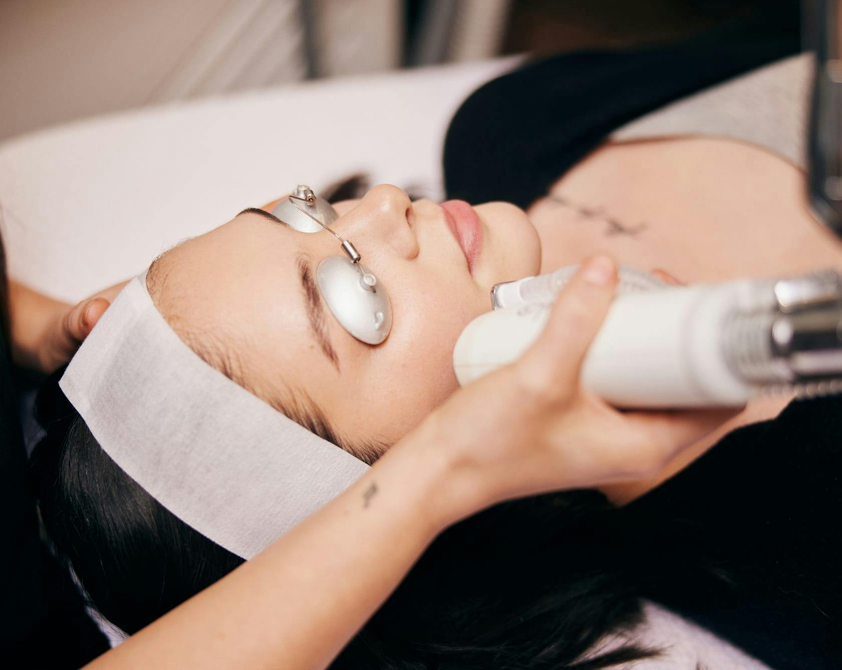 and image of a patient getting a laser facial treatment