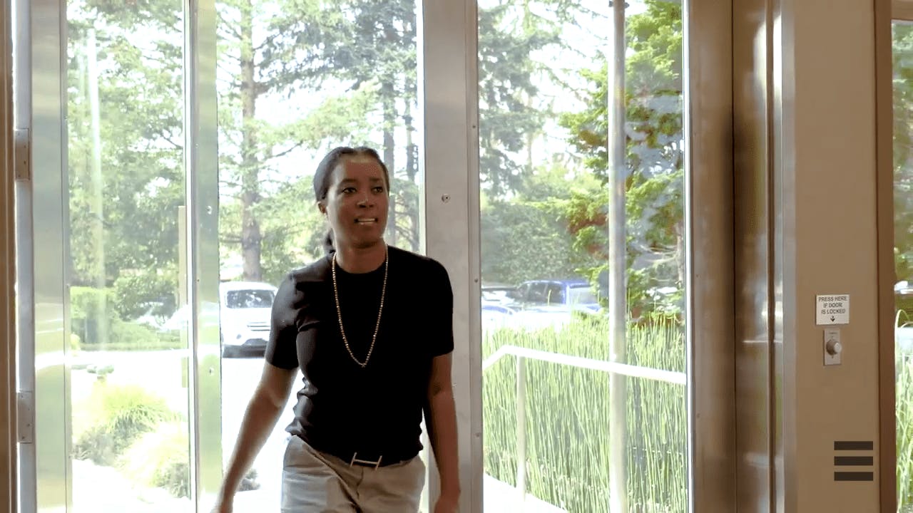 an image of a woman walking into the practice