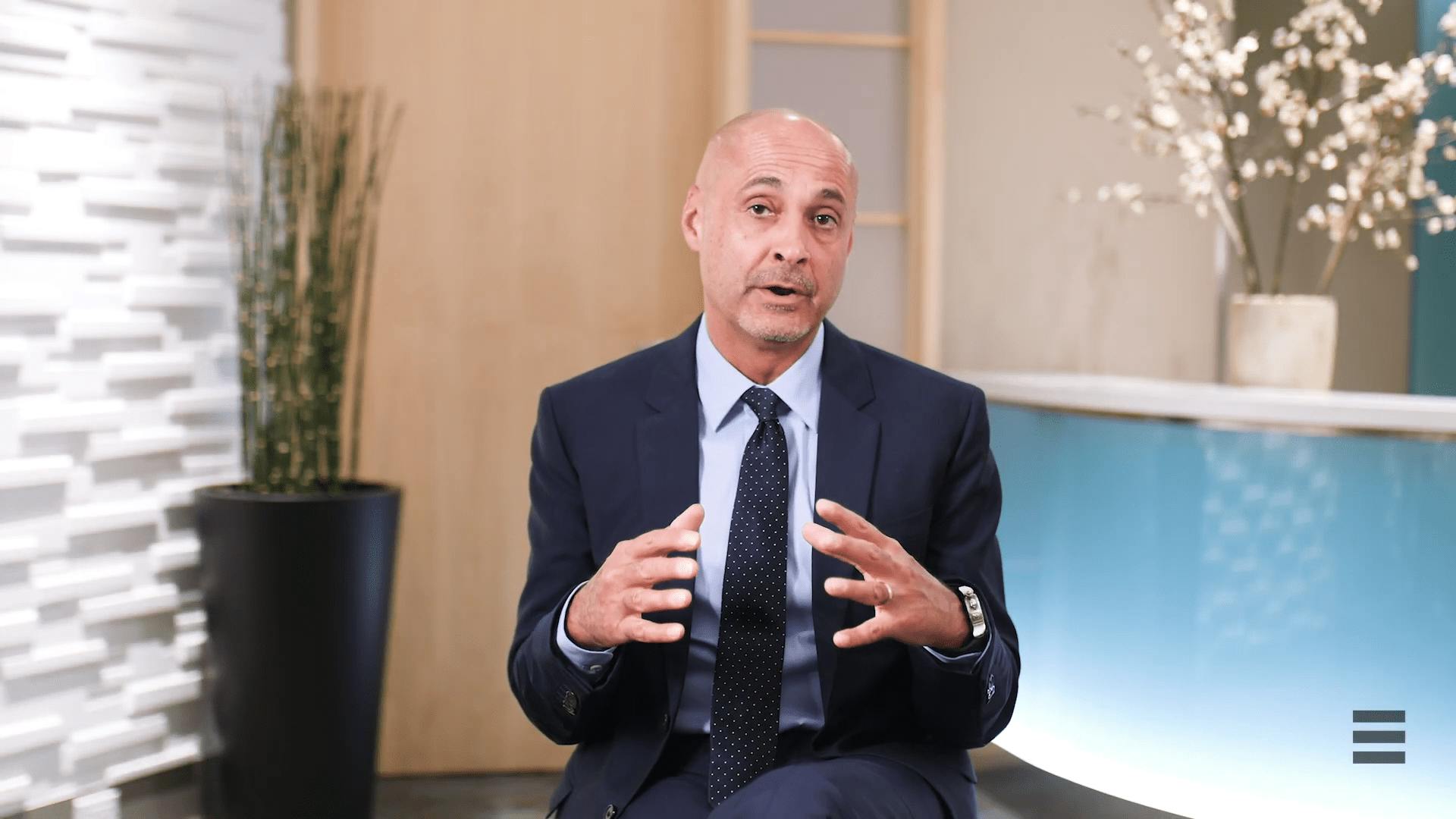 an image of Dr. Egrari doing an interview