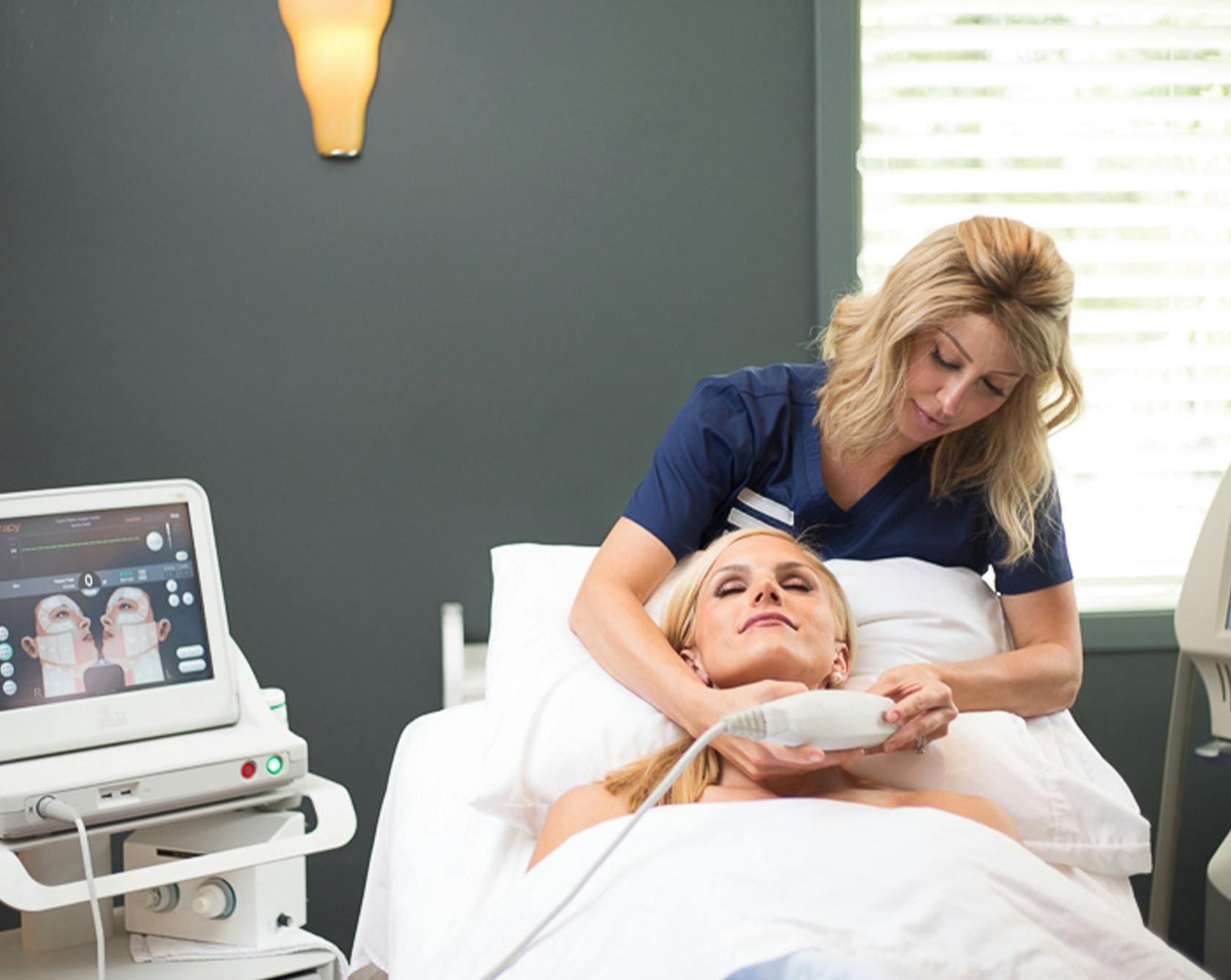 an image of a staff member at ENIC doing a laser treatment on a patient