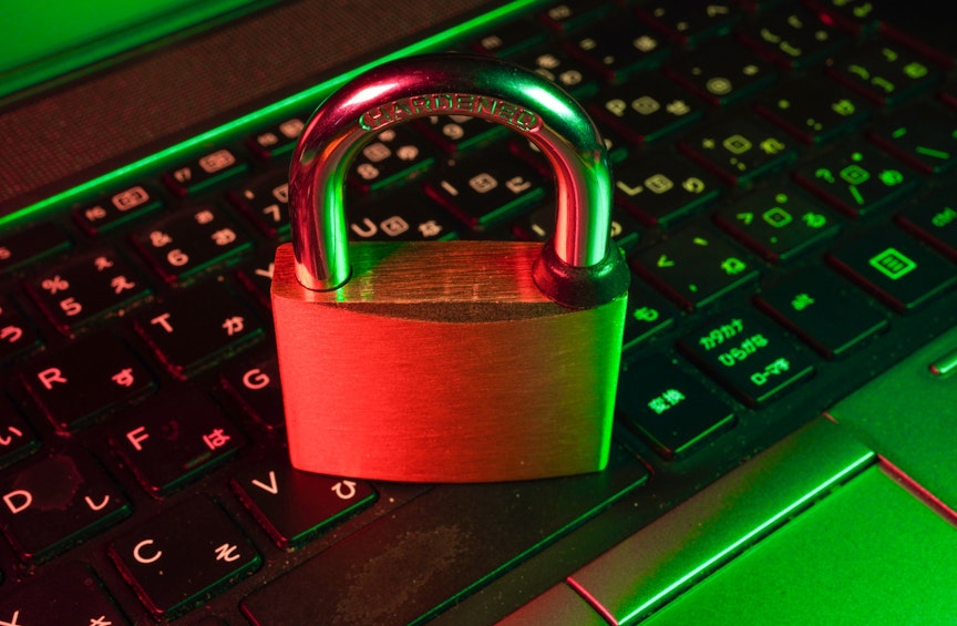 red padlock on black computer keyboard