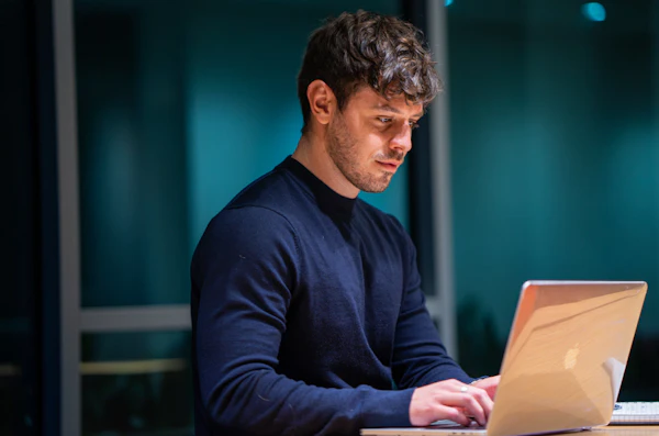 Image of man by the computer