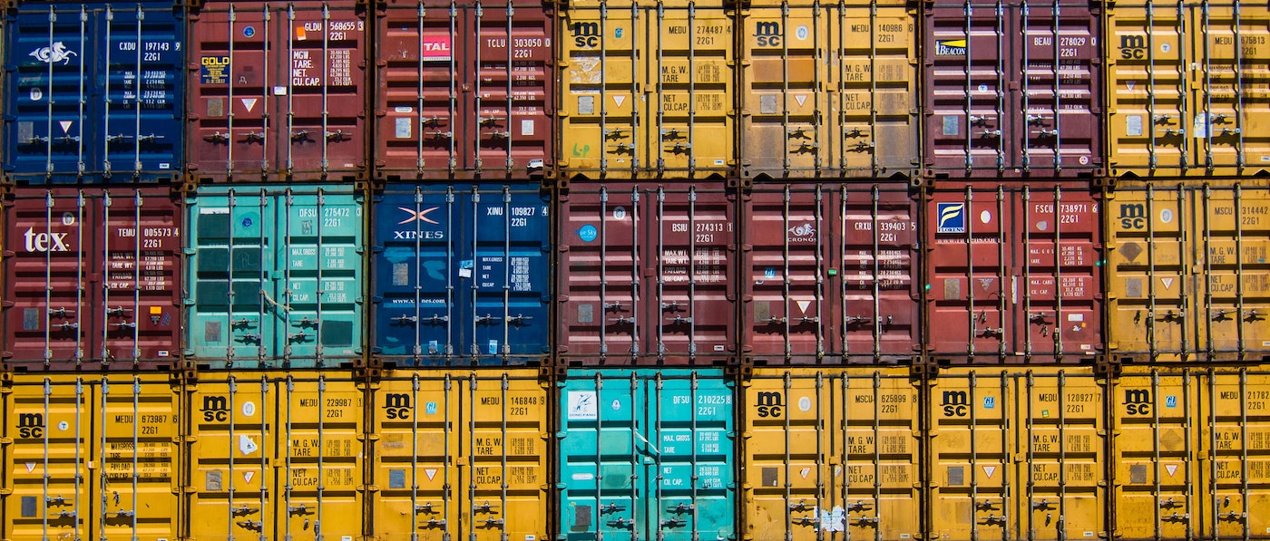Several shipping containers piled up