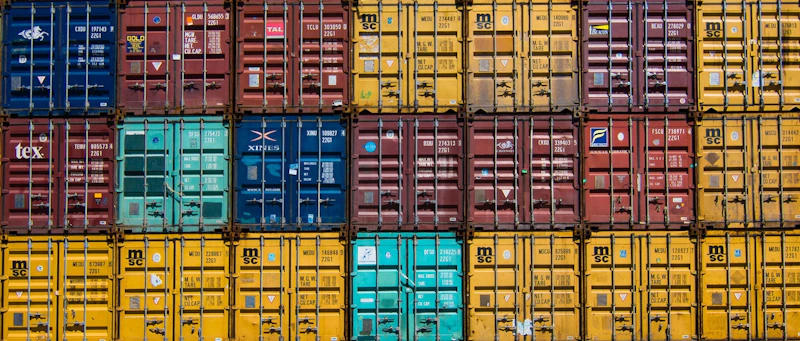 Several shipping containers piled up