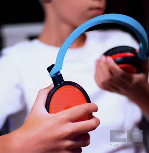 Person holding red and blue headphones