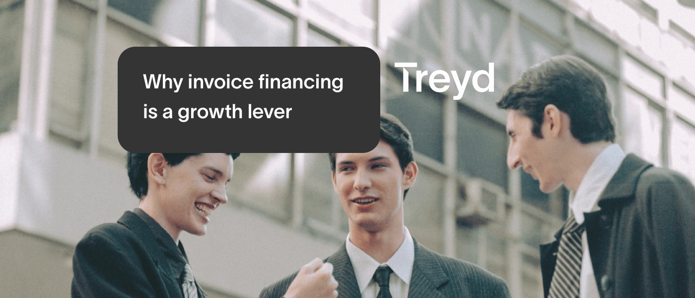 three people in front of office building joking around