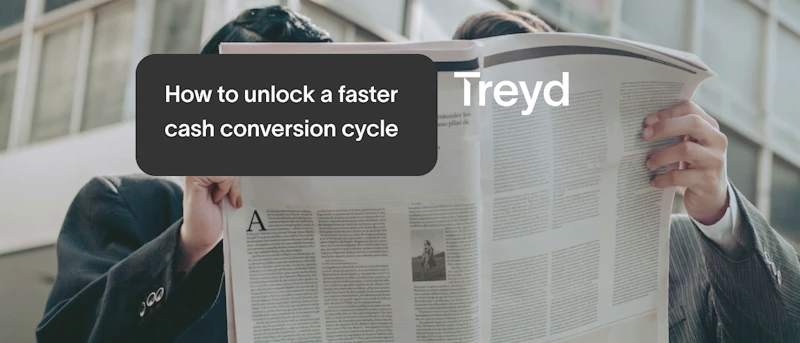 two persons sharing a big newspaper