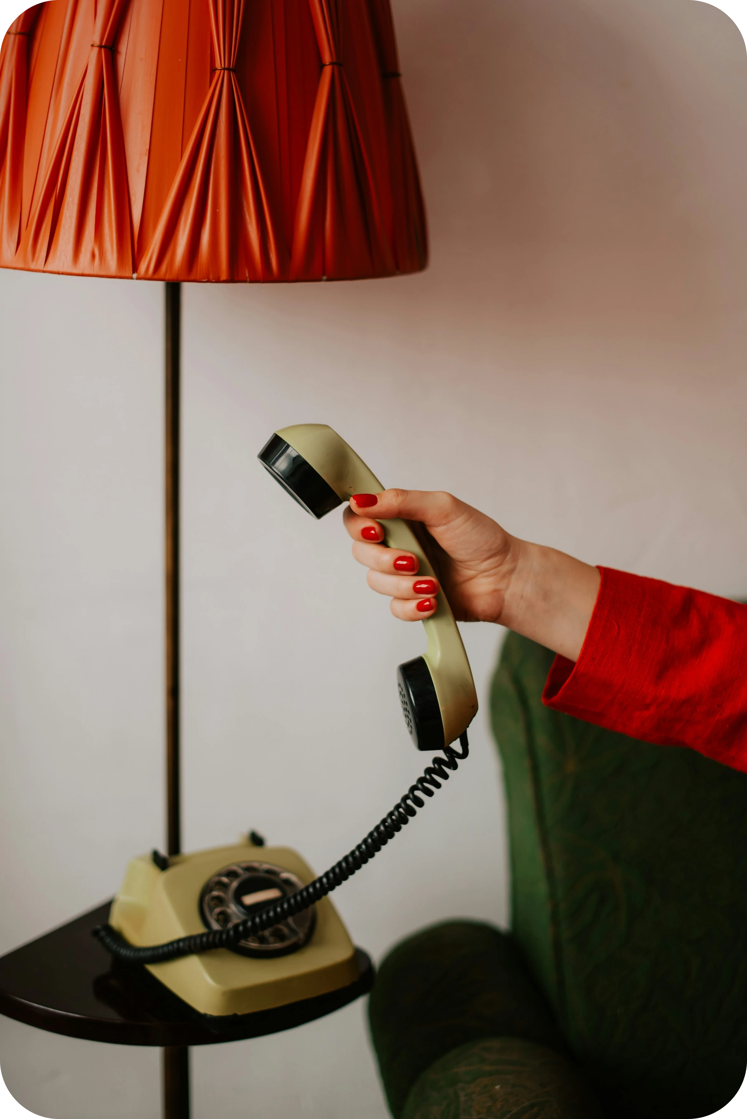 hand picking up an old-school phone