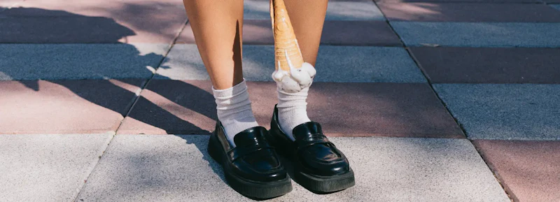 Ice cream cone just before falling on a pair of loafers, representing the cash flow problems that hit product businesses during growth